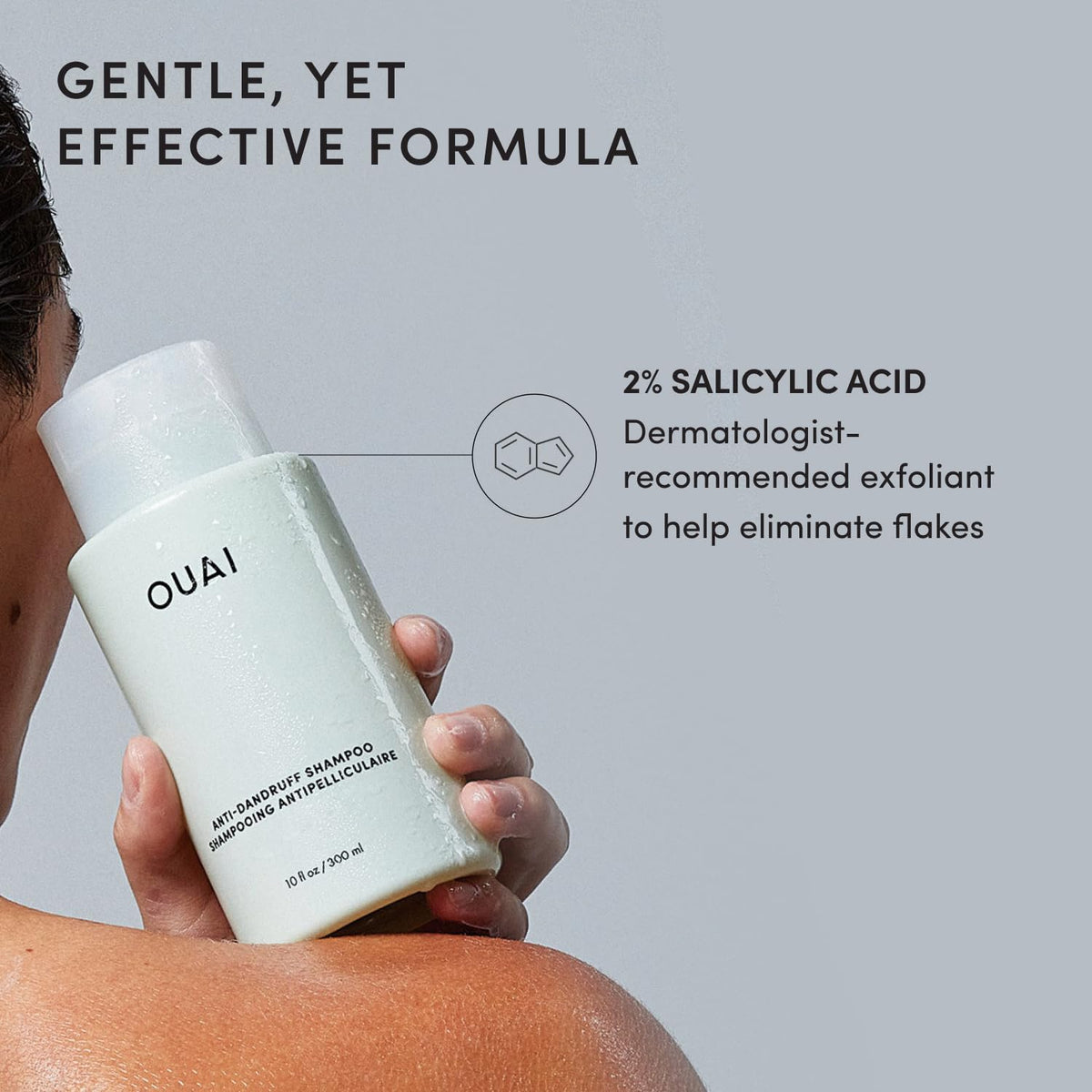OUAI shampoo scale with hand showing 10 fl oz size and travel clarity