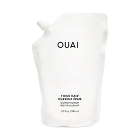 OUAI refill pouch front view showing product branding and large size benefit