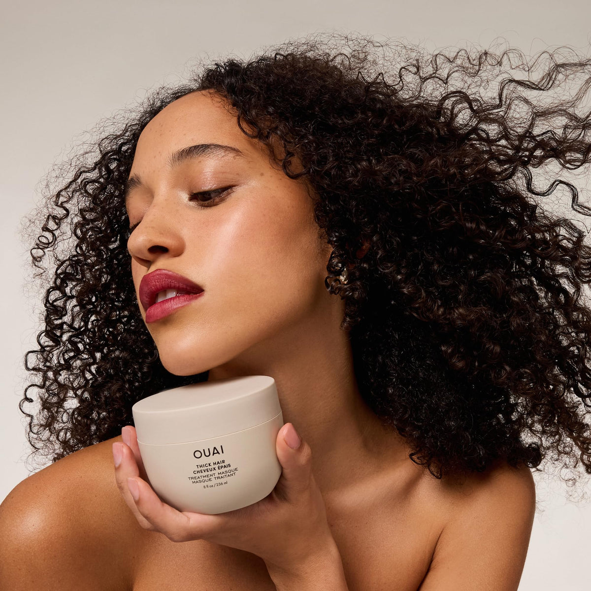 OUAI hair mask applied in shower illustrating quick five-minute treatment benefit