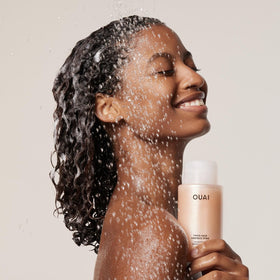 OUAI creamy shampoo texture close-up showing slip for easier detangling