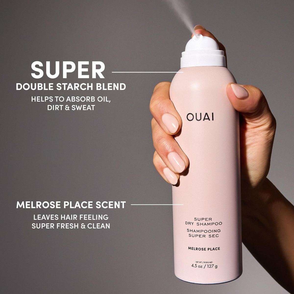 OUAI travel can beside a hand for scale shows pocketable convenience