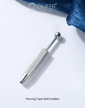 OUFER grabber with compact storage case showing travel-friendly organization