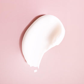 Ouidad conditioner cream texture close-up showing moisturization and detangling benefit