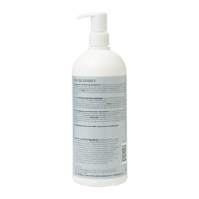 Close-up of Ouidad cream texture highlighting thick slip for easier detangling