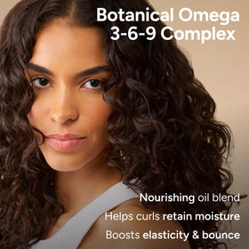 Ouidad being lathered into wet curly hair for improved curl definition