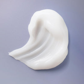 Ouidad product label close-up highlighting ingredients and clean formulation benefit