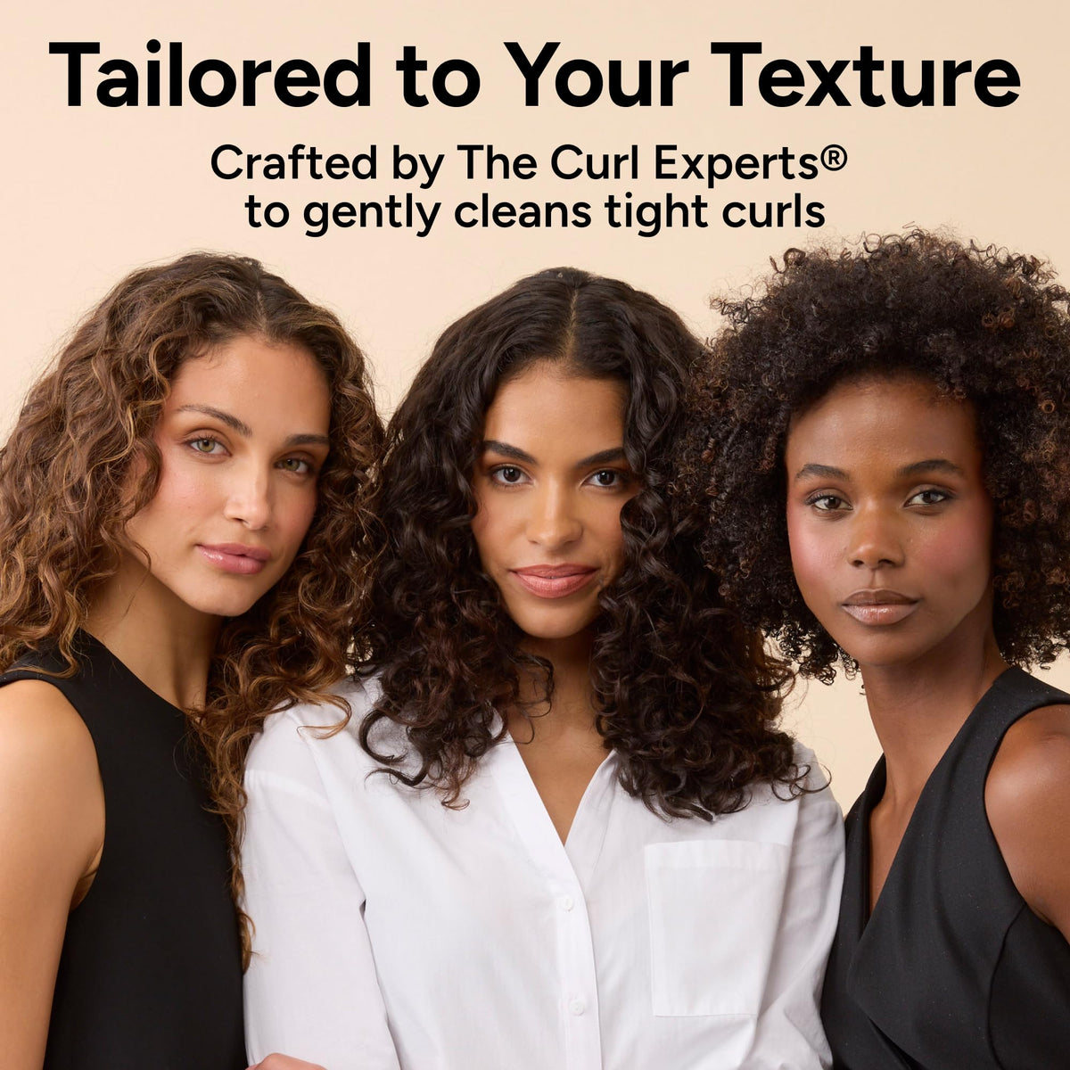 Bathroom shelf lifestyle with Ouidad bottle showing salon-developed curl care aesthetic