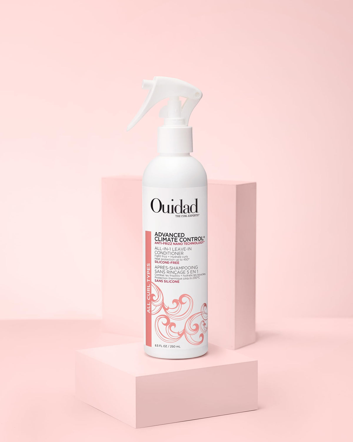 Ouidad bottle on bathroom shelf near styling tools to inspire daily curl routine