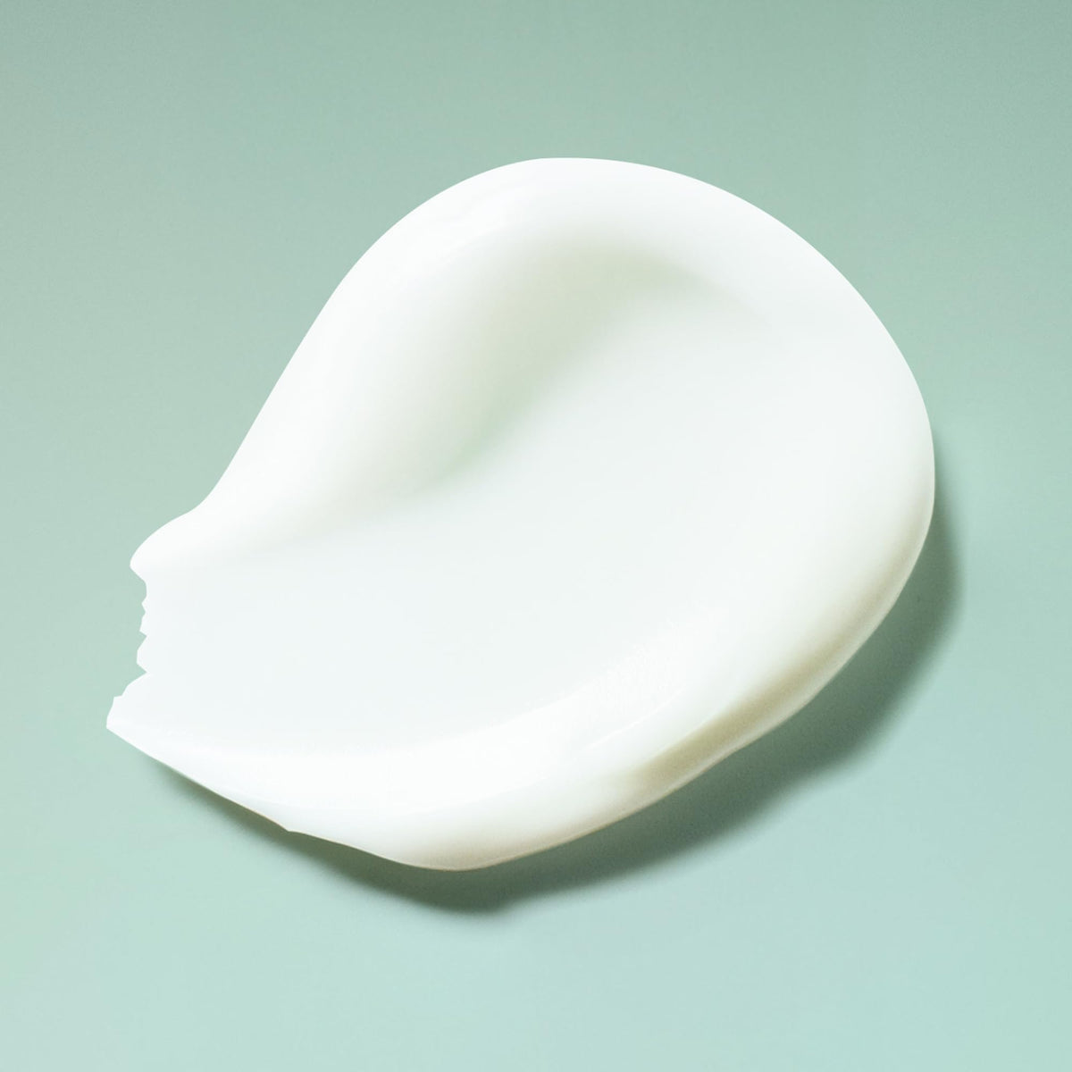 Ouidad shampoo on bathroom shelf suggesting daily curl-care routine benefits