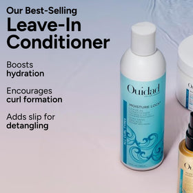 Bottle held in hand showing Ouidad 8.5 fl oz size and travel scale