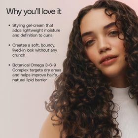 Ouidad product used while diffusing curly hair for defined, bouncy results