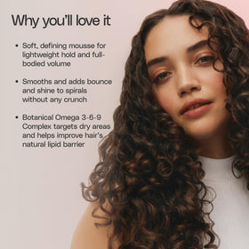Ingredient label detail on Ouidad VitalCurl+ highlighting vitamins and botanical oils