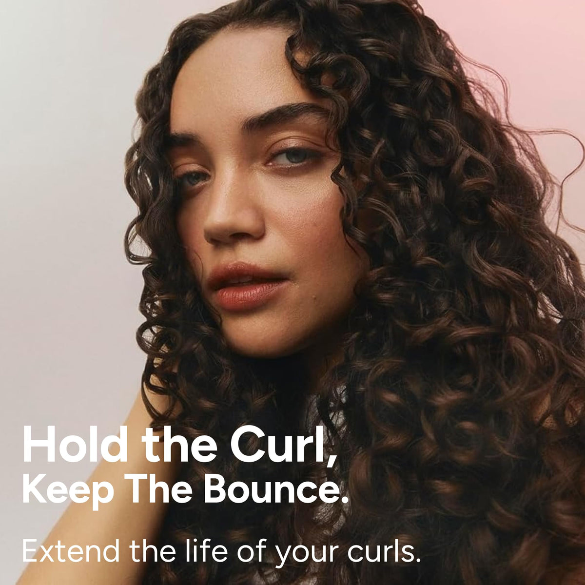 Before and after curls using Ouidad showing improved definition and bounce
