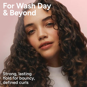 Ouidad gel staged on bathroom shelf conveying daily styling convenience