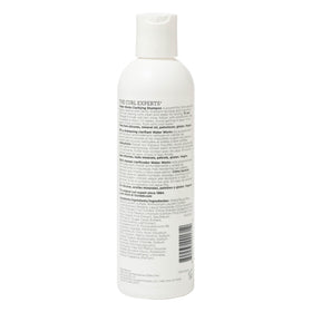 Ouidad Water Works shampoo lathering in curly hair for deep-clean benefits and softer curls