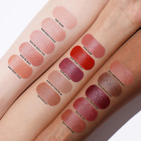 Oulac lipstick flat lay with ingredients showing hyaluronic acid and oils