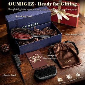 Oumigiz in-use slick-back styling showing polished finish and frizz control