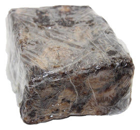 Our Earth's Secrets close-up of raw soap texture and natural particles, shows handcrafted quality