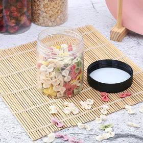 OUSHINAN jar in hand showing 8oz scale and portion control benefit