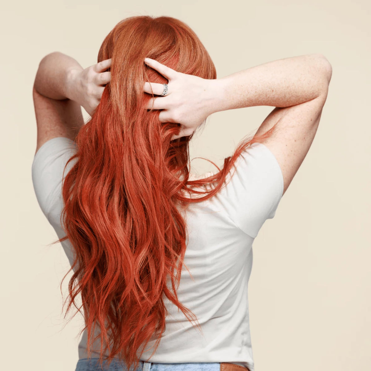 oVertone model with vibrant golden copper hair showcasing refreshed color and shine