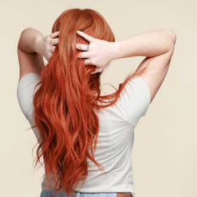 oVertone model with vibrant golden copper hair showcasing refreshed color and shine