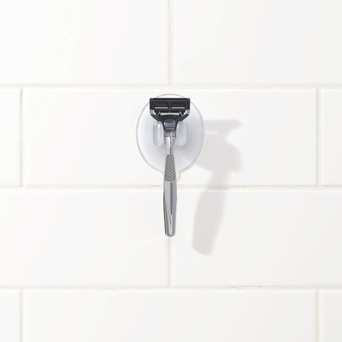 OXO size comparison next to razor showing compact footprint advantage