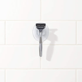 OXO size comparison next to razor showing compact footprint advantage