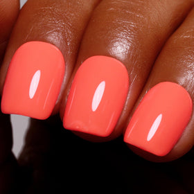 Ozzeal bottle front view showing bright coral orange shade and clear label for instant color recognition