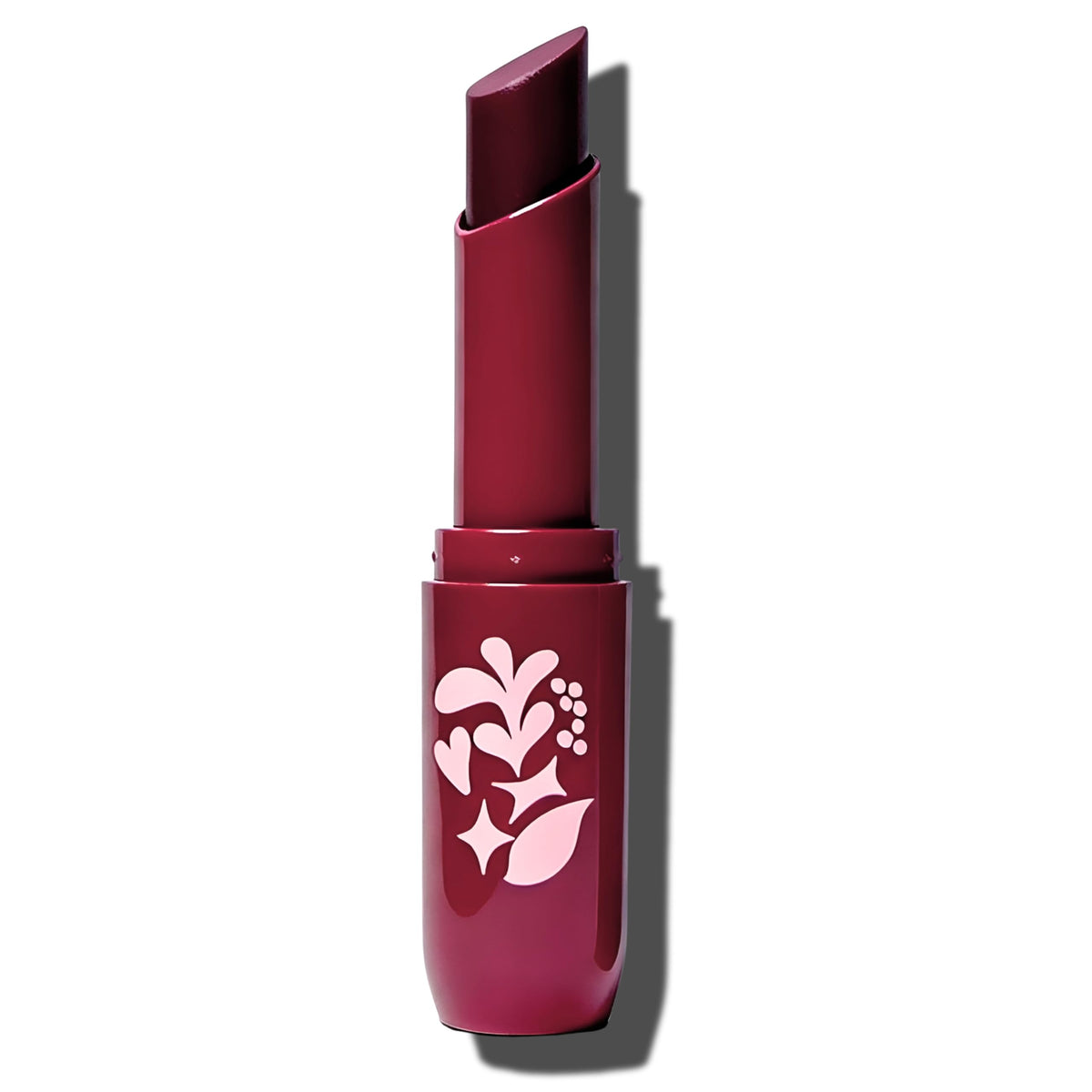 Pacifica lip butter next to coin showing compact travel-ready size and convenience