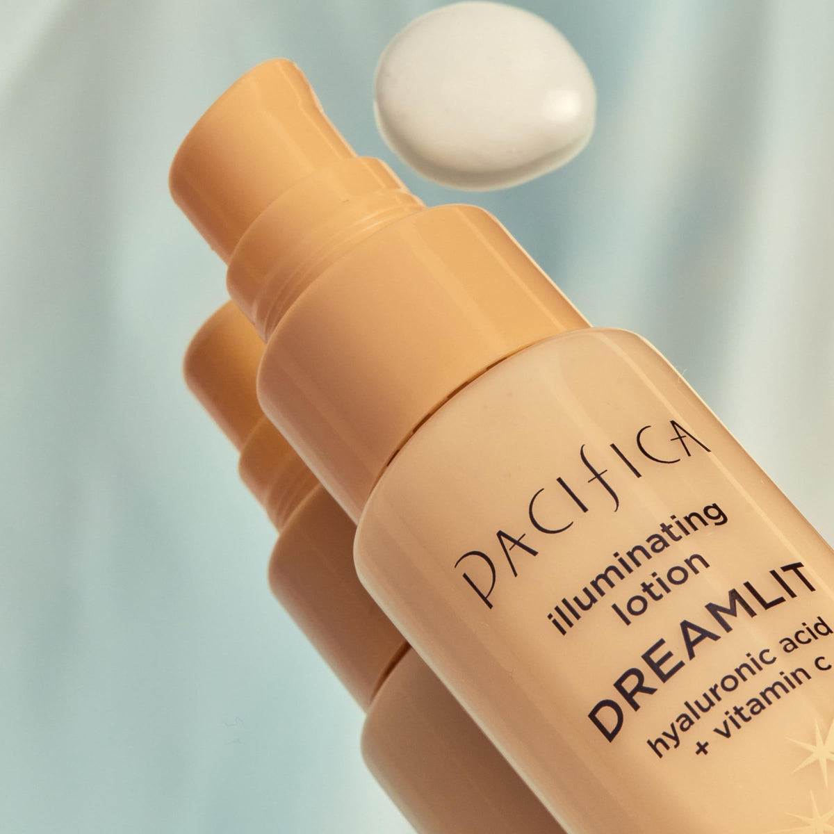 Pacifica Dreamlit applied on hand demonstrating hydration and sheen