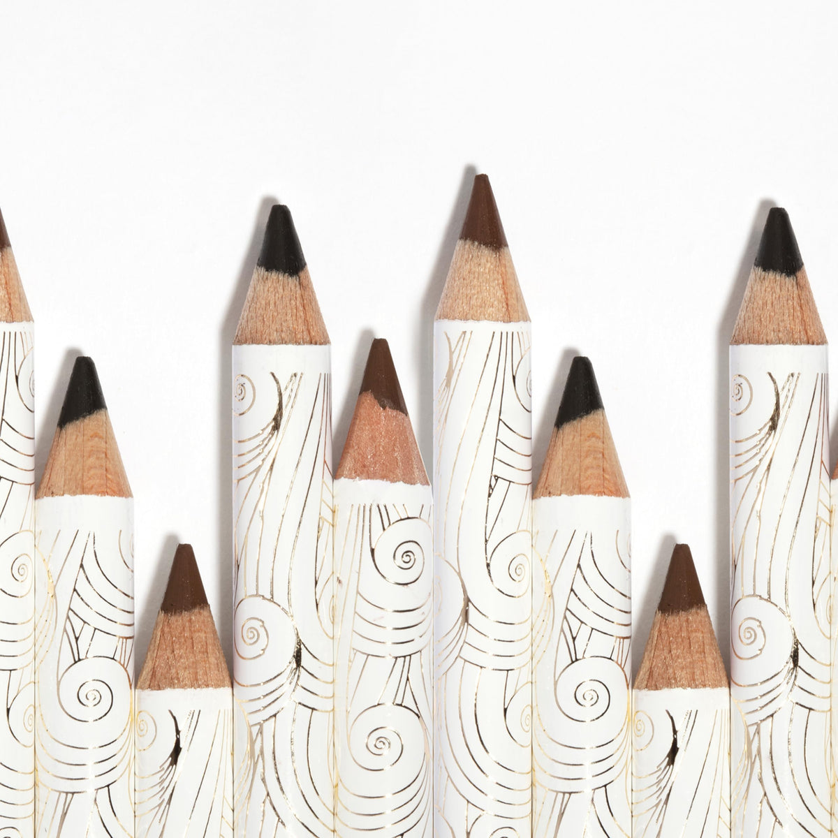 Pacifica Fringe pencil beside coin showing compact travel size