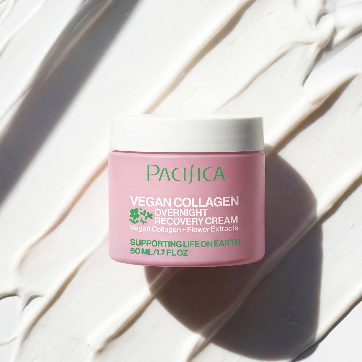 Pacifica night cream next to a coin to show jar size and travel-friendly scale