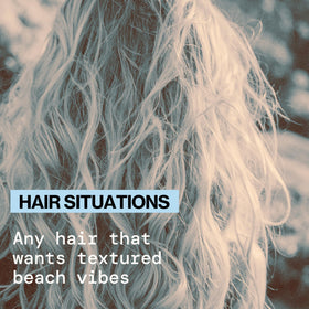 Applying Pacifica Salty Waves to damp hair for hydrated beachy texture