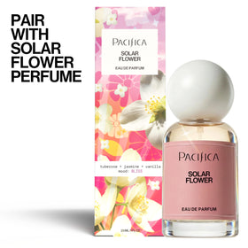 Pacifica Solar Flower next to a hand for scale to show the convenient 5 fl oz travel-ready size