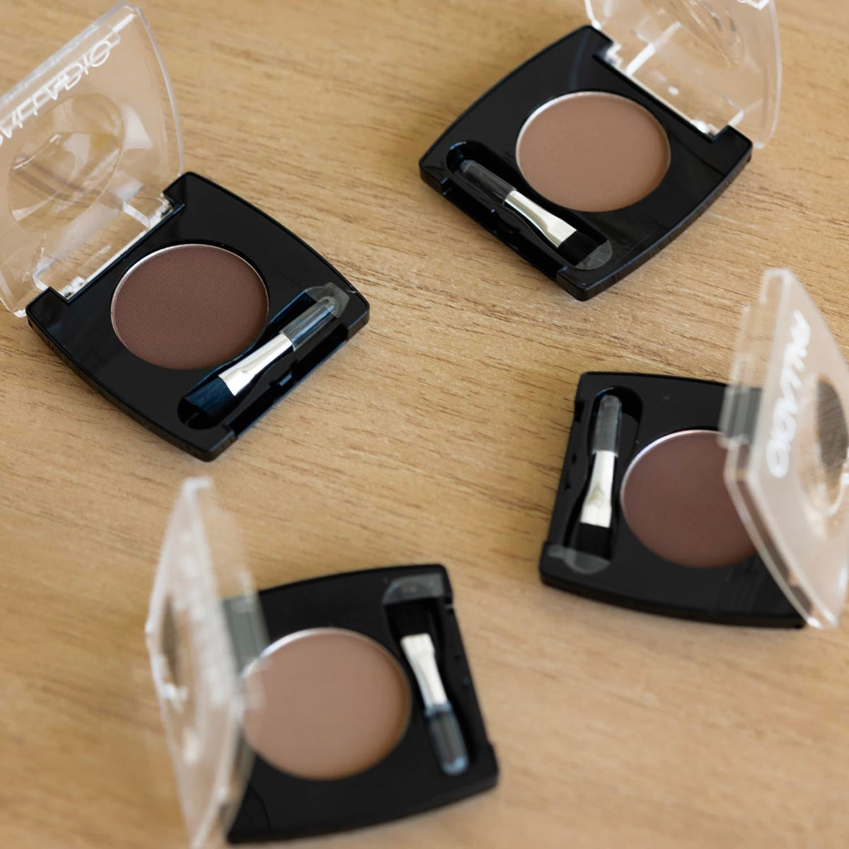 Palladio compact held in hand showing mirror for quick travel-friendly makeup checks