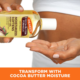 Hands applying Palmer's oil to damp skin demonstrating hydrated, non-greasy finish
