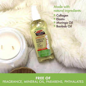 Palmer's bottle held in hand showing travel-friendly 3.4 oz convenience