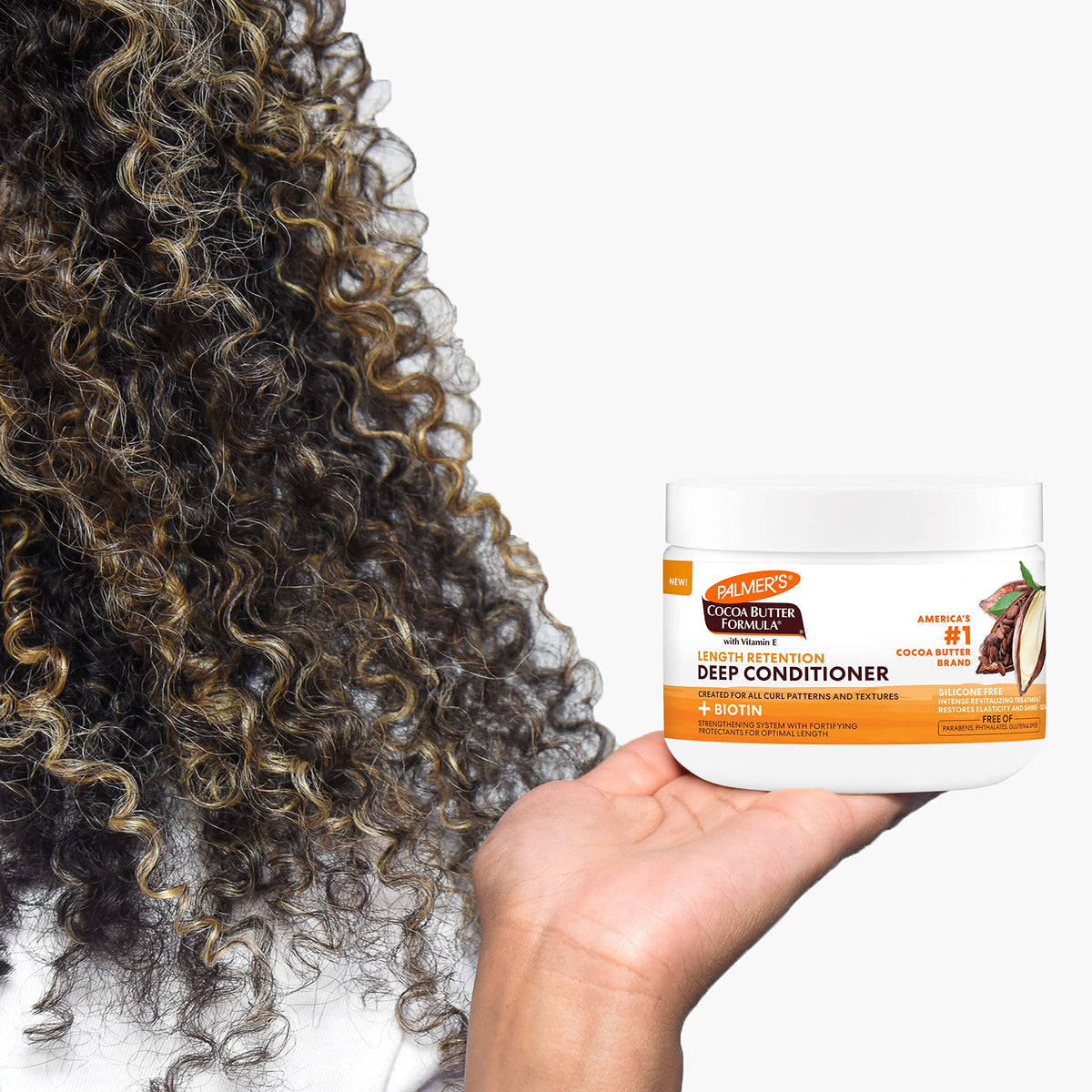 Palmer's conditioner being applied to hands ready to detangle and nourish