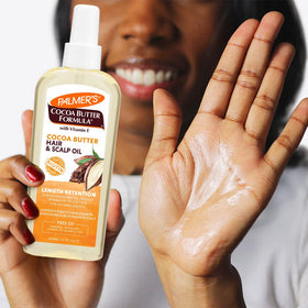 Palmer's biotin and cocoa butter ingredients visual emphasizing strength
