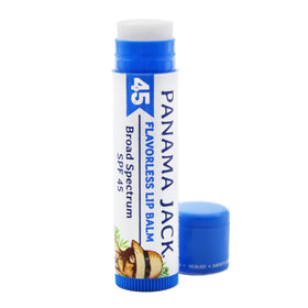 Lifestyle photo of Panama Jack lip balm on a beach towel demonstrating practical sun-care use outdoors