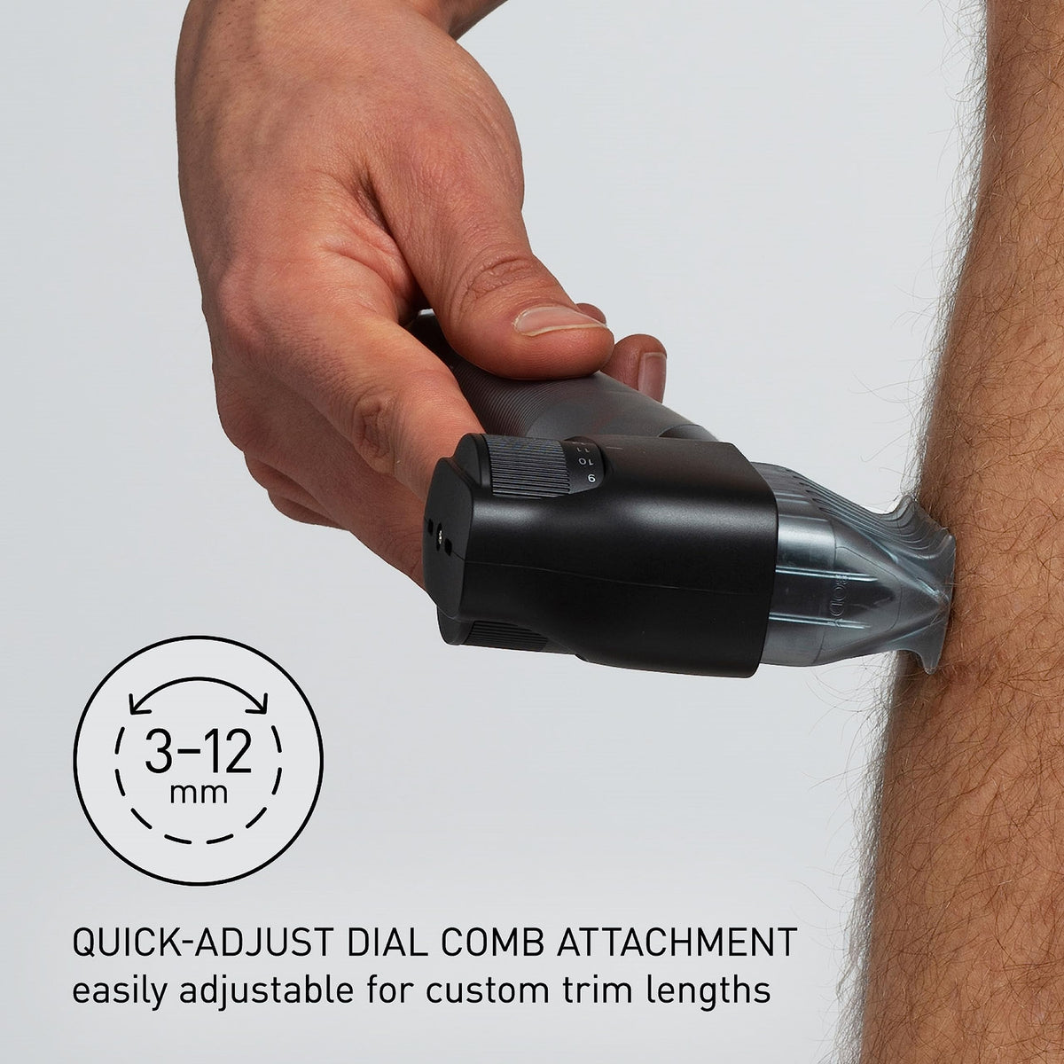 Panasonic groomer held in hand showing scale and ergonomic I-shaped grip