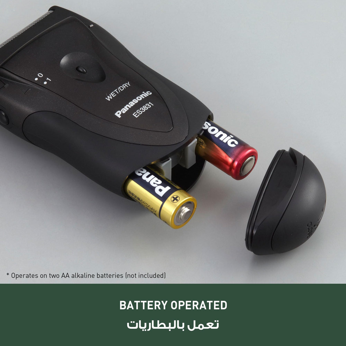 Panasonic ES3831K next to AA batteries showing battery-powered portability