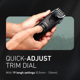 Panasonic trimmer held in hand highlighting ergonomic rubberized grip for control