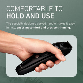 Panasonic trimmer beside a passport demonstrating travel-friendly size and portability