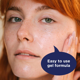 PanOxyl adapalene tube next to moisturizer showing layering to reduce dryness benefit