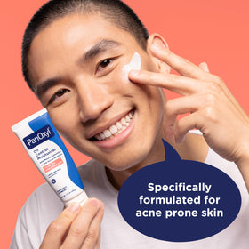 PanOxyl moisturizer being spread on hand showing fast-absorbing oil control