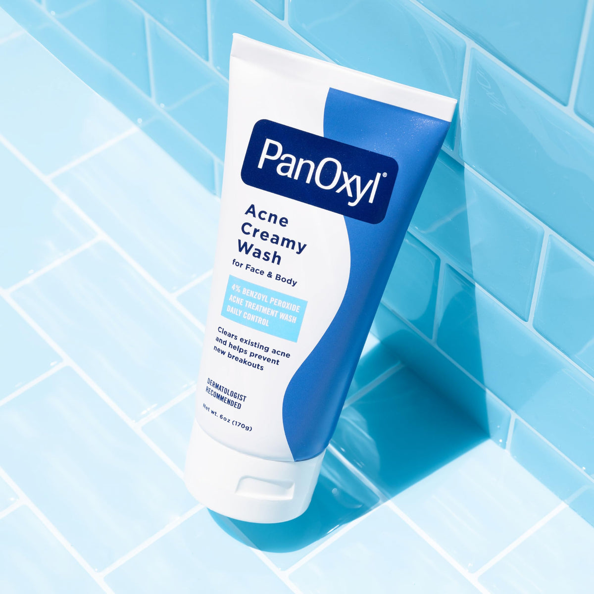 Lather of PanOxyl creamy wash on hand showing thorough pore-cleansing action