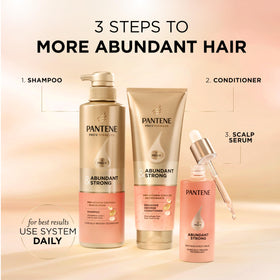 Pantene bottles held in hand to show actual product sizes and scale