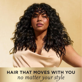 Pantene styled model with defined curls showing frizz control and soft finish