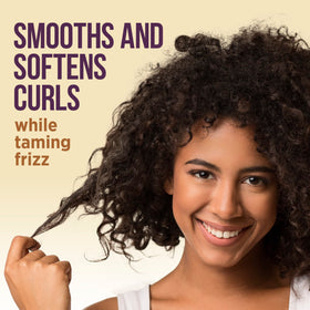 Pantene Gold Series milk texture on fingers highlighting smooth, lightweight slip benefit